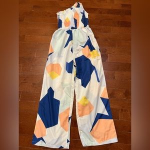 One shoulder geometric jumpsuit, size SMALL.